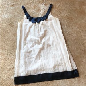 White Dress with Navy Neckline and Hem Detail